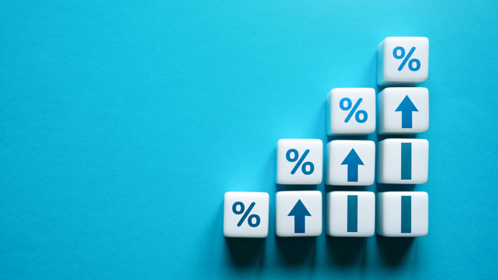 White dice representing the incremental maturity stages of usage data shot against a sea blue background.