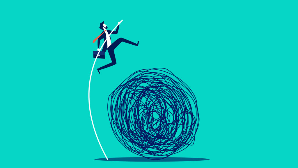 A businessman jumps over a ball of tumbleweed, which represents data challenges.